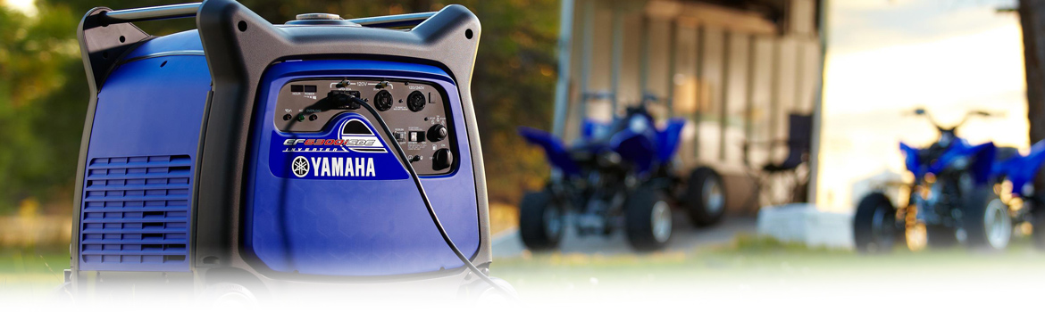 2017 Yamaha EF6300iSDE Generator in the grass next to a trailer, available in Platinum Powersports,