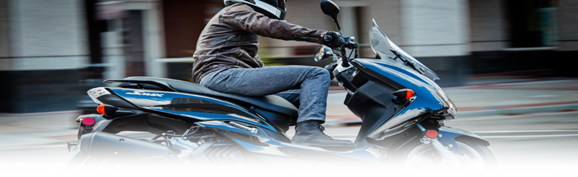 2017 Yamaha Cmax with a guy driving around town, available in Platinum Powersports,